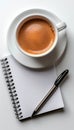 Minimalist workspace with blank notebook, pen, and coffee cup on light background