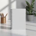 Minimalist Workspace with Blank Spiral Notebook and Gold Pencil Holder Royalty Free Stock Photo