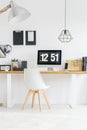 Minimalist workspace with designer chair