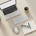 Laptop with black keys a wireless keyboard and mouse on a round Royalty Free Stock Photo