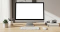 Minimalist Workspace Featuring Modern Computer Display, Keyboard, and Desk Accessories Royalty Free Stock Photo