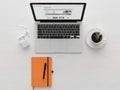 Minimalist workspace with laptop, coffee, and notebook Royalty Free Stock Photo