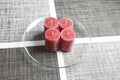 Minimalistic advent wreath, four candles on glass plate