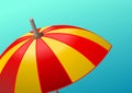 Minimalistic background with beach umbrella in the foreground over clear blue sky. Suggestive of a summer day. Royalty Free Stock Photo