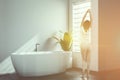 White minimalistic bathroom corner, woman Royalty Free Stock Photo