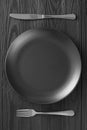 Minimalistic black background table setting in a restaurant. minimalism of table setting, top view