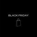 A minimalistic black Friday poster featuring a shopping bag on a black background Royalty Free Stock Photo