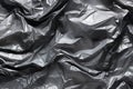 Minimalistic black texture of transparent wrinkled plastic. Crumpled wrinkled plastic cellophane. Reflects light and shadow on the