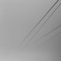 Minimalistic black and white image of cable way dissolving in a