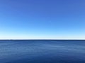 Minimalistic blue seascape with clear contrast horizon and still water Royalty Free Stock Photo