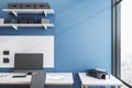 Minimalistic blue workplace with ÃÂomputer on table Royalty Free Stock Photo