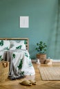 Cosy, boho bedroom interior with wooden bed. Royalty Free Stock Photo