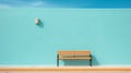 Minimalistic Color Photography: Unoccupied Bench Against Pretty Blue Wall