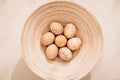 Minimalistic composition. Easter eggs on a plate. Eco style. Warm pastel tones. View from above Royalty Free Stock Photo