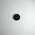 A minimalistic composition featuring a single black circle centered on a plain white Royalty Free Stock Photo