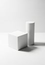 A minimalistic composition featuring two geometric shapesâa white cube and a Royalty Free Stock Photo