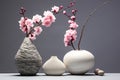 Minimalistic composition with pink blooming sakuras in a clay handmade vases