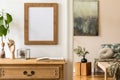 Minimalistic compositon with wooden vintage commode, brown mock up photo frame, avocado plant, plant, elegant personal accessories