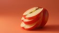Minimalistic Sliced Red Apple Against a Soft Orange Background Royalty Free Stock Photo