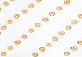 Cookies pretzels pattern on white background. Flat lay, top view