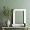 Interior with white wooden picture photo frame on table. Olive twig in vintage silver vase, jug created with Generative AI. Royalty Free Stock Photo