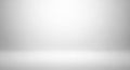 A minimalistic, empty space featuring a smooth gradient background transitioning from light gray at Royalty Free Stock Photo