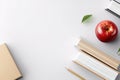 Minimalistic flat illustration stack of books and apple on white background. image emphasizes study, creativity, knowledge, Royalty Free Stock Photo