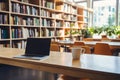 Minimalistic home office with laptop, coffee cup, and blurred bright living room view Royalty Free Stock Photo