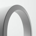 A minimalistic image featuring a portion of a large, smooth, gray ring. The ring has a Royalty Free Stock Photo