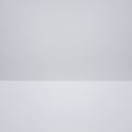 Minimalistic image featuring a stark, white plain surface meeting a light gray Royalty Free Stock Photo
