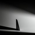 Minimalistic image featuring a tall, triangular, three-dimensional structure on a Royalty Free Stock Photo