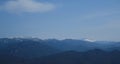 Minimalistic landscape , no people. View of snowy peak of Mount Fisht from afar. Main Caucasian ridge in reserve