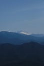 Minimalistic landscape , no people. View of snowy peak of Mount Fisht from afar. Main Caucasian ridge in reserve