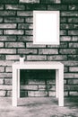 Minimalistic loft-style interior with a white table, mock up white picture frame or photo frame on a brick wall, black and white Royalty Free Stock Photo