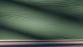 Minimalistic modern background with wavy green lines, abstract geometric pattern, futuristic wall design, soft shadows on textured Royalty Free Stock Photo
