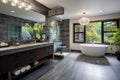 A minimalistic modern bathroom with standalone bathtub and shower, long sink and ficus plant Royalty Free Stock Photo