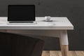 Minimalistic office with empty laptop screen