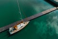 Minimalistic orange boat  on the blue water of the river  shot from above Royalty Free Stock Photo