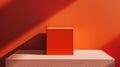 Minimalistic orange cube on a red background