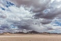 Minimalistic pan of the Namib desert with mountains and cloudy sky. Royalty Free Stock Photo