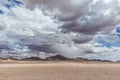 Minimalistic pan of the Namib desert with mountains and cloudy sky. Royalty Free Stock Photo