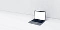 Minimalistic photo of laptop with mockup on white table with copy space.