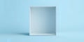 A minimalistic photo of a white empty box against a light blue background in studio light Royalty Free Stock Photo