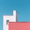 Minimalistic Photography: Pink Building Against Blue Sky