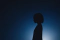 Minimalistic portrait silhouette with tenebrism effect on dark background Royalty Free Stock Photo