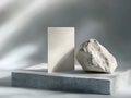 Minimalistic product display with concrete base and natural stone element Royalty Free Stock Photo