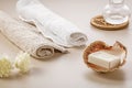 Two soft towels, dried flowers and a bar of soap in a sea shell on the dressing table Royalty Free Stock Photo
