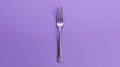 Minimalistic Silver Fork On Purple Background For Design Concept