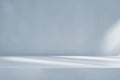 Minimalistic simple background for product presentation. Shadow and light from windows on a light blue wall Royalty Free Stock Photo