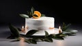 Minimalistic single tier wedding cake with white icing and sliced orange and eucalyptus decoration. Close up, background, top view